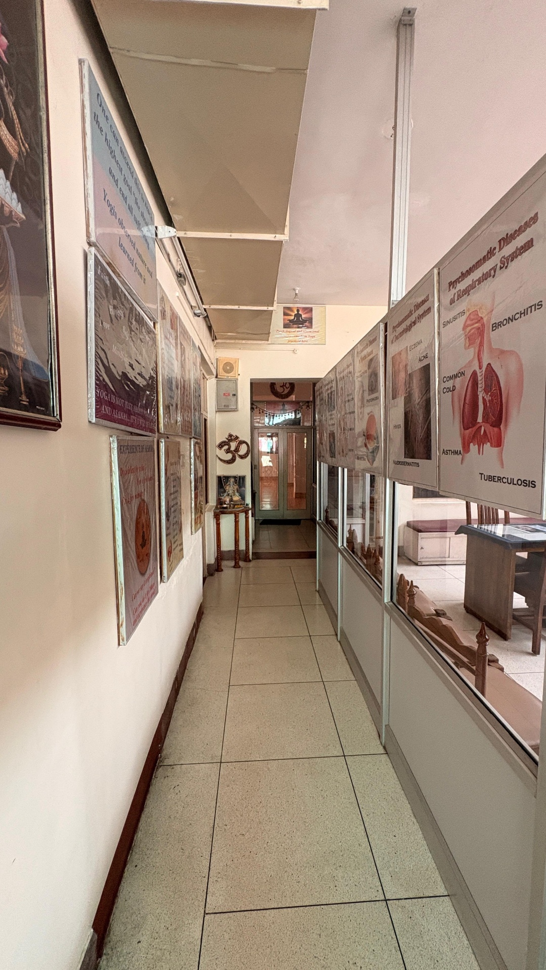 Corridor lined with Sanskrit shlokas and anatomy charts